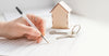person-signing-housing-contract